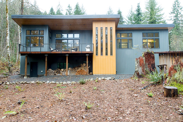 Snowline contemporary chalet with golden-yellow accent tower