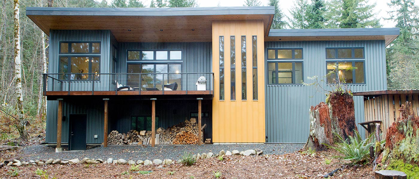 Contemporary chalet with a golden-yellow accent tower built by Kestrel And Sons